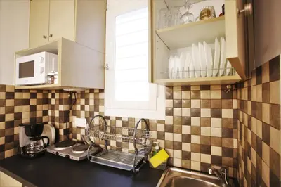 a kitchen counter with a sink and a window at GK Aria by GK Properties in Athens