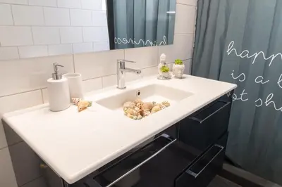 a bathroom with a sink and a mirror at Chalandri Sweet House in Athens