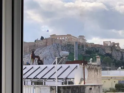 a view of the acropolis from a window at Vintage Apartment in Athens