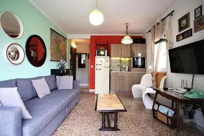 a living room with a couch and a table at Vintage Apartment in Athens