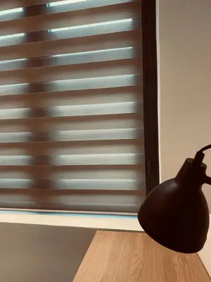 a black vase sitting on the floor next to a window at Small Meisonette Near The Metro VIPGreece in Athens