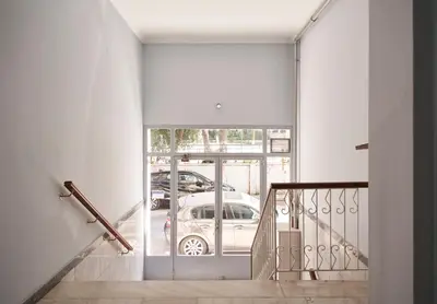 a staircase with a glass door with a car outside at Elite Living 2bd Apt next to Hilton-Ilisia Park in Athens