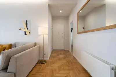 a living room with a couch and a mirror at The Athens Gathering, Hip area and sightseeing in Athens