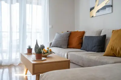 a living room with a couch and a coffee table at The Athens Gathering, Hip area and sightseeing in Athens