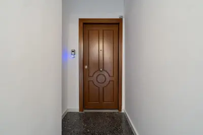a wooden door in a room with a corridor at The Athens Gathering, Hip area and sightseeing in Athens