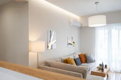 a living room with a couch and a table at The Athens Gathering, Hip area and sightseeing in Athens