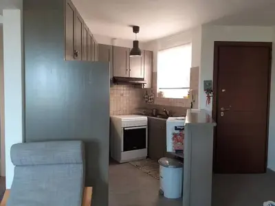 a small kitchen with a sink and a stove at Breezy summer maisonette with exciting view! in Aghia Marina