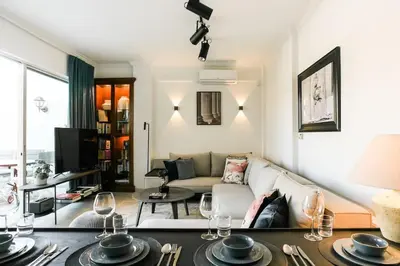 a living room with a couch and a table at Acropolis Veranda Residence in Athens
