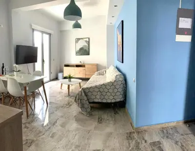 a living room with a couch and a table at WUKELA APARTMENTS in Athens