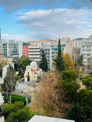 a view of a city with buildings and trees at WUKELA APARTMENTS in Athens