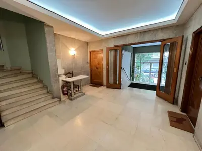 a hallway with stairs and a skylight at Bang in Kolonaki by Athenian Homes in Athens