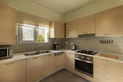 a kitchen with a sink and a stove top oven at 3BR Prime APT a breath away from the Acropolis! in Athens