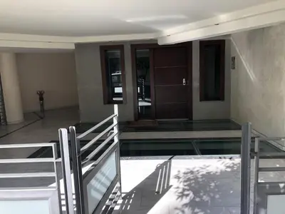 a house with a glass floor and a staircase at 3BR Prime APT a breath away from the Acropolis! in Athens