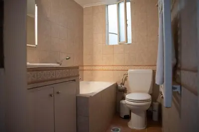 a bathroom with a white toilet and a sink at Nikea apartment near Piraeus port and metro st II in Piraeus
