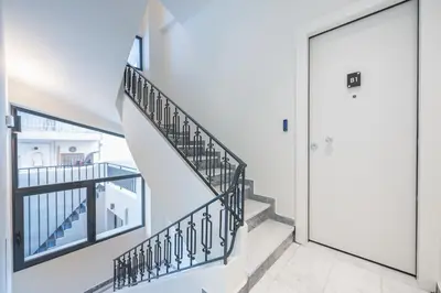 a staircase in a house with a door at The Asprogeraka - self check-in rooms in Athens