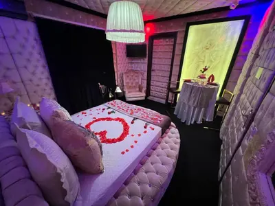 a room with a bed with a red number on it at Xcite Hotel Salem in Athens