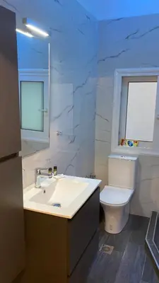 a bathroom with a sink and a toilet at Chris AKROPOLI in Athens