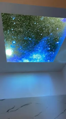 a television with a depiction of a universe at Chris AKROPOLI in Athens