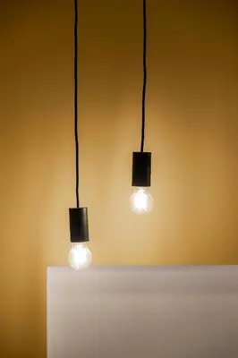 two lights on top of a white table at Calliope Apartment in Athens