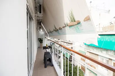 a balcony with a view of a swimming pool at Aphrodite Apartment in Athens