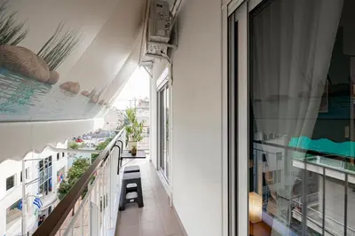 an apartment balcony with a view of a swimming pool at Aphrodite Apartment in Athens