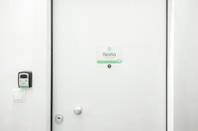 a door with a hello sign on it at Hestia Apartment in Athens