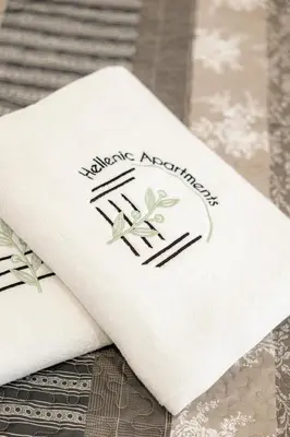 a white napkin with the words happy anniversary on it at Hestia Apartment in Athens