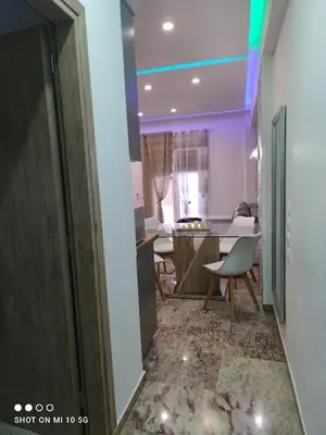 a room with a hallway with a table and a chair at Lovely luxury apartment Sokratous 133, Kallithea in Athens