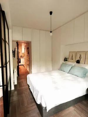 a bedroom with a large white bed in it at Vibrant Urban Chic Apartment in Athens