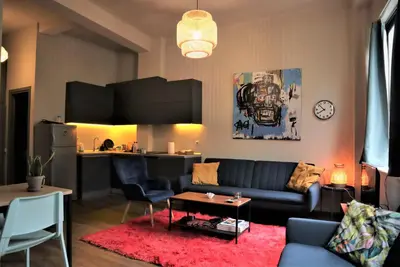 a living room with a couch and a table at Central studio in Monastiraki in Athens