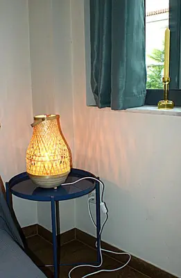 a vase on a table in a room with a window at Central studio in Monastiraki in Athens