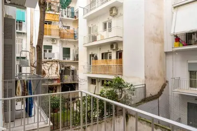 a view of a balcony of an apartment building at Irene's Beauty in Koukaki in Athens