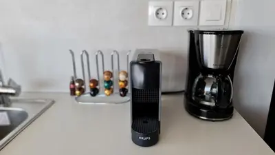 a kitchen counter with a blender on a counter top at Xenophon Suite at National Opera SNFCC Park in Athens