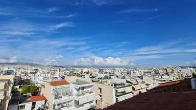 a view of a city with white buildings at Xenophon Suite at National Opera SNFCC Park in Athens