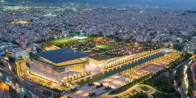 an aerial view of a city at night at Xenophon Suite at National Opera SNFCC Park in Athens