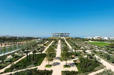 an aerial view of a park with trees and a building at Xenophon Suite at National Opera SNFCC Park in Athens