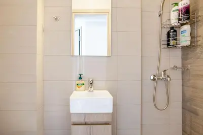 a bathroom with a sink and a shower at 7-Athens new morden comfortable-center,metro,private parking in Athens