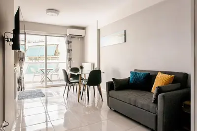 a living room with a couch and a table at 7-Athens new morden comfortable-center,metro,private parking in Athens