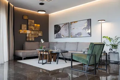 a living room with a couch and a table at Athenian Riviera Luxurious Residence in Athens