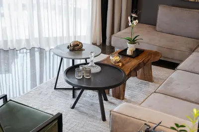 a living room with two tables and a couch at Athenian Riviera Luxurious Residence in Athens