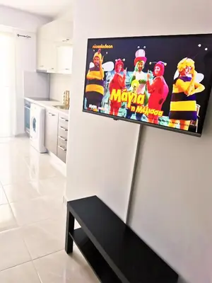 a poster on a wall in a kitchen at Santo House in Athens