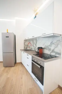 a kitchen with a sink and a refrigerator at A.P Athens in Athens