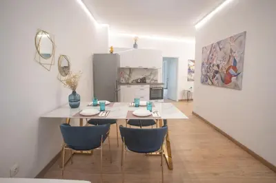 a kitchen and dining room with a table and chairs at A.P Athens in Athens