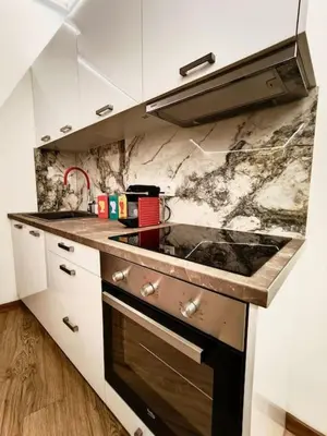 a kitchen with a sink and a stove top oven at A.P Athens in Athens