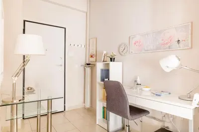 a room with a desk with a chair and a mirror at Modern full apt near acropolis/vaccinatedHosts in Athens