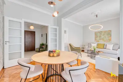 a dining room and living room with a table and chairs at Contemporary 2-BDR APT near Kalimarmaro & Alsos Park! in Athens