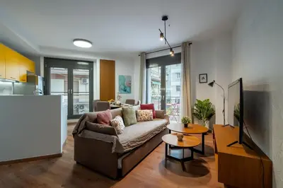 a living room with a couch and a table at Strefi Hill Suites in Athens