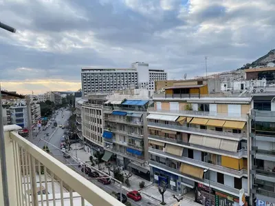 a view from a balcony of a city with buildings at Athens Skylight Condo in Athens