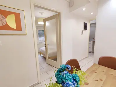 a dining room with a table and a mirror at Avli apartment in Athens