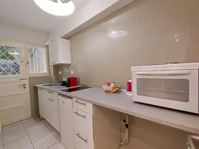 a kitchen with a microwave on a counter at Avli apartment in Athens